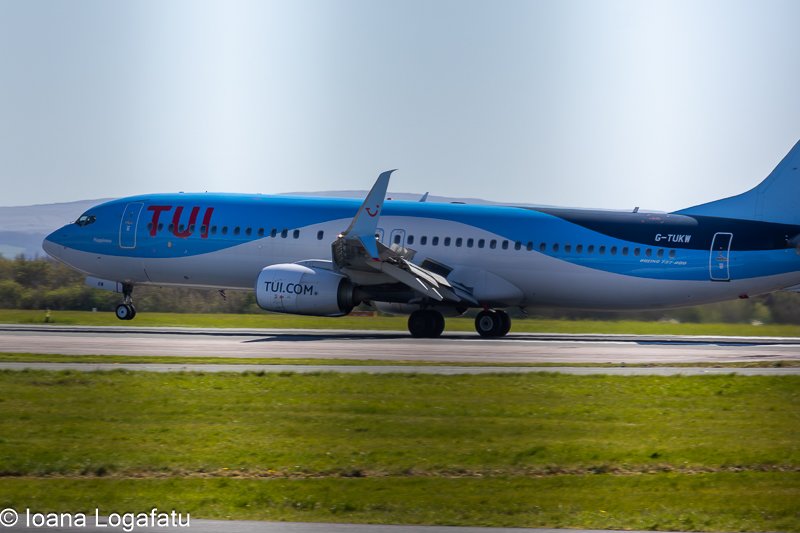 Plane takes off from the busy airport runway